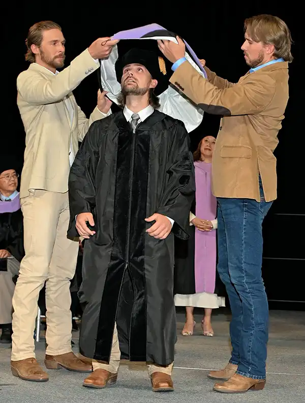 Dr. Kody Osborne from Osborne Dentistry in Lebanon, OR at graduation ceremony with Orin and Wyatt